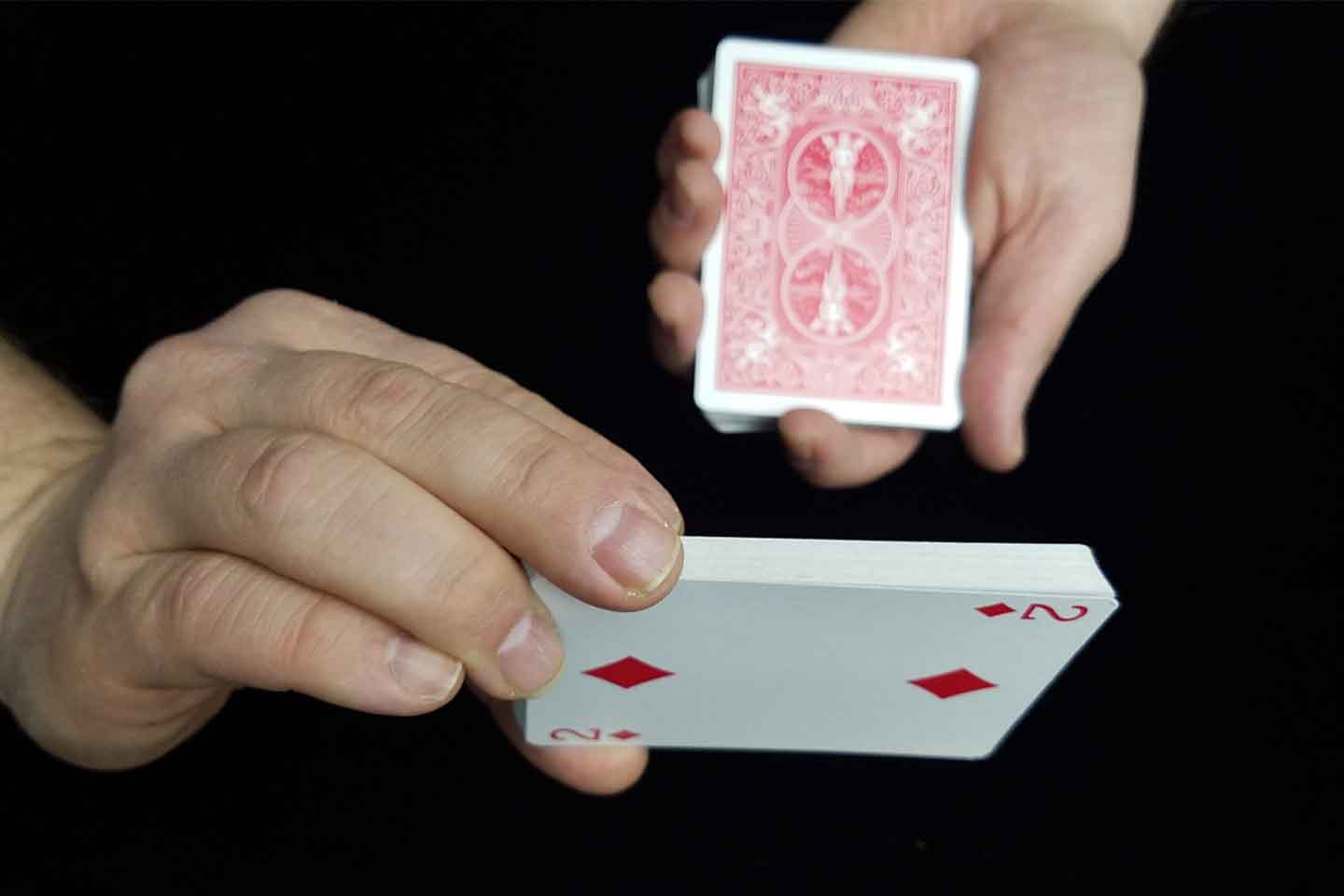 How do you create playing card magic?
