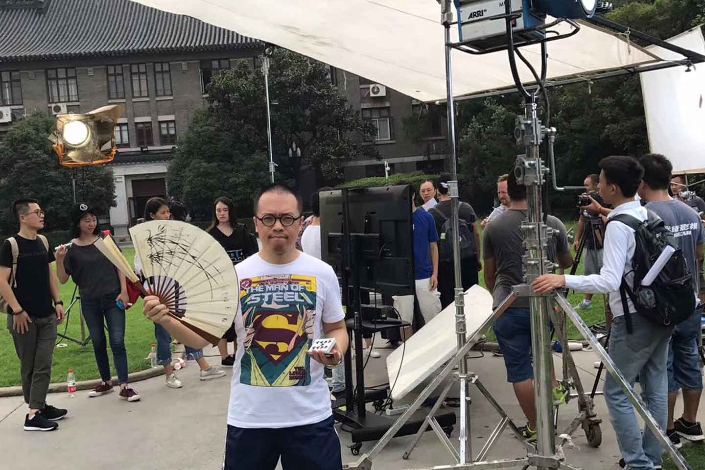 Magic Consultant Kemin Zhang in between takes on set while filming at Nanjing University. JSBC Street Show Magic Consultant Kemin Zhang